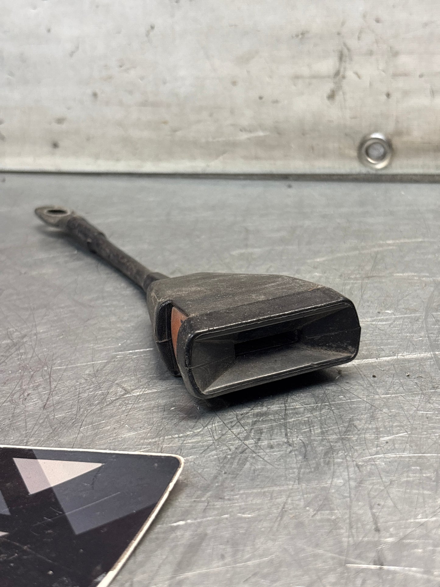 Used Porsche 924 early left seat belt anchor clasp retainer, buckle. 477857755D (used)