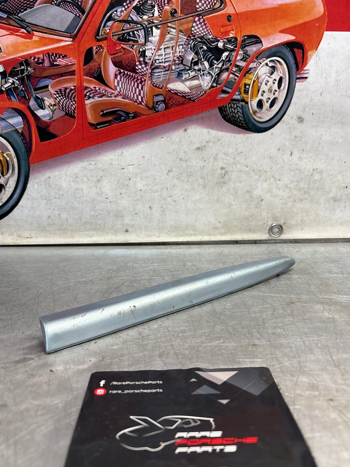 Porsche 928 left side front wing molding trim, used 92855903703