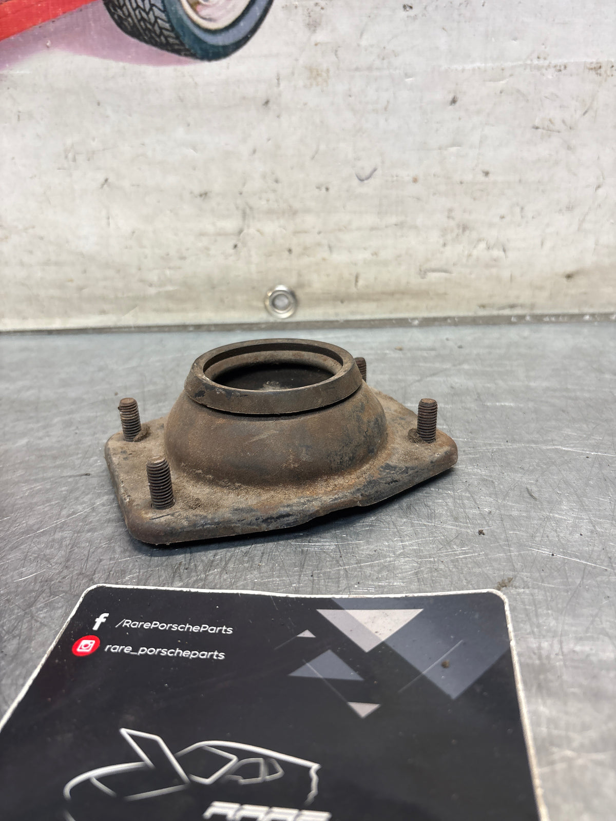Porsche 924 / 944 front suspension bearing flange, 477412345, used