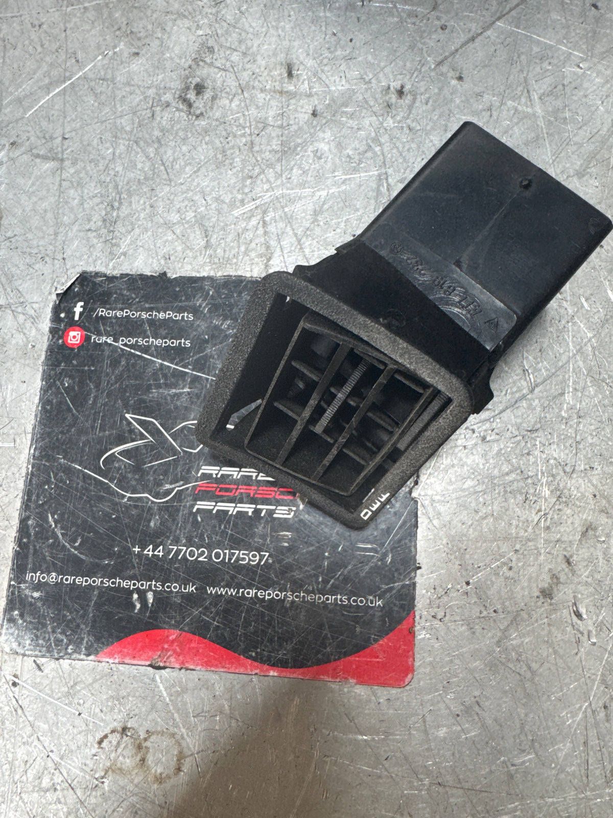 Porsche 924/944 Black dash air vent. Right, with connecting piece 477819232 / 477819717 used spares or repair