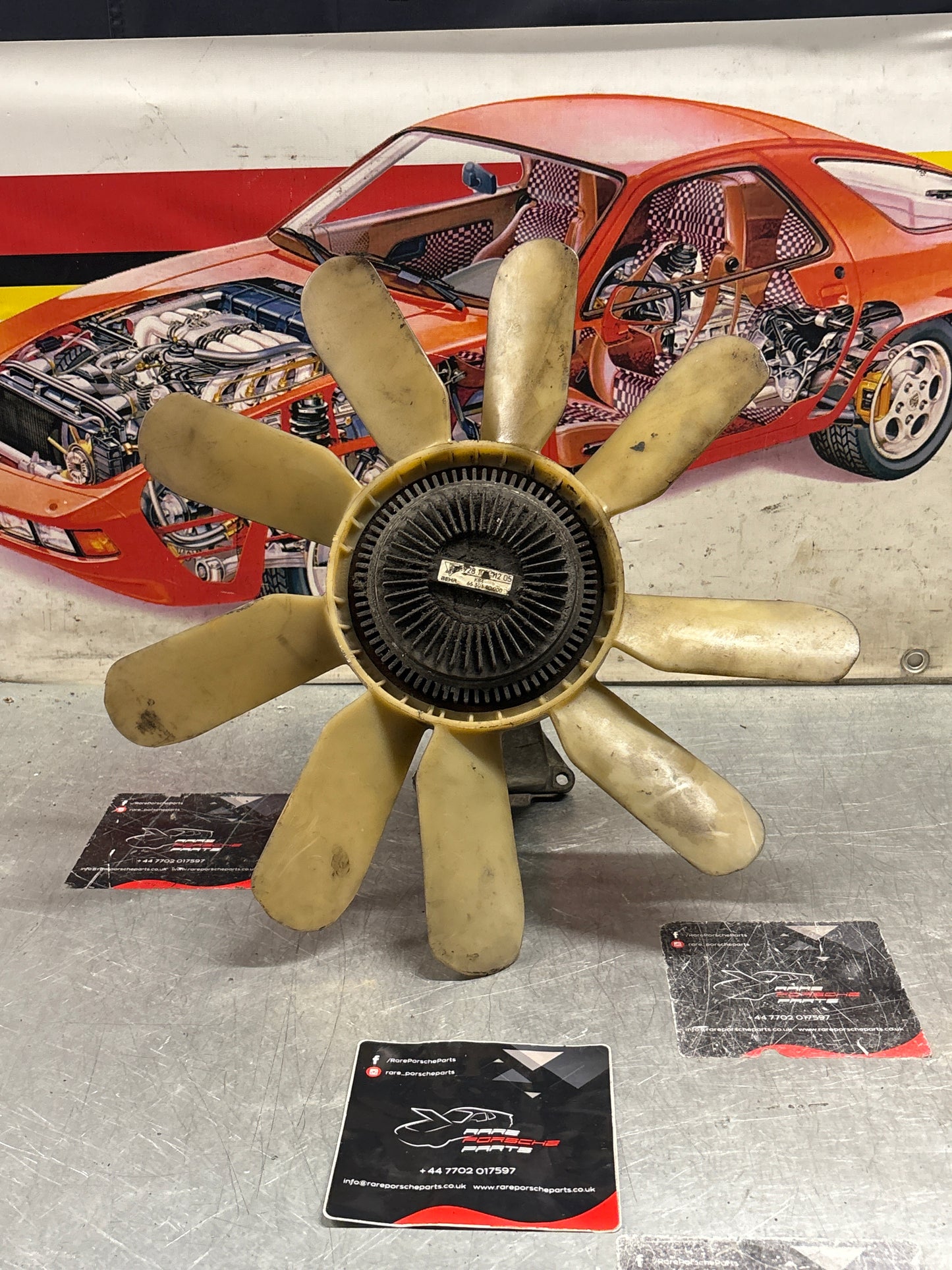 Porsche 928 late engine cooling fan clutch with bracket, used 92810611205 / 92810613701 / 9281061104R