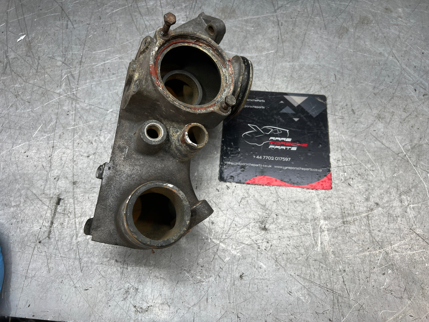 Porsche 928 thermostat housing, used 9281061614R