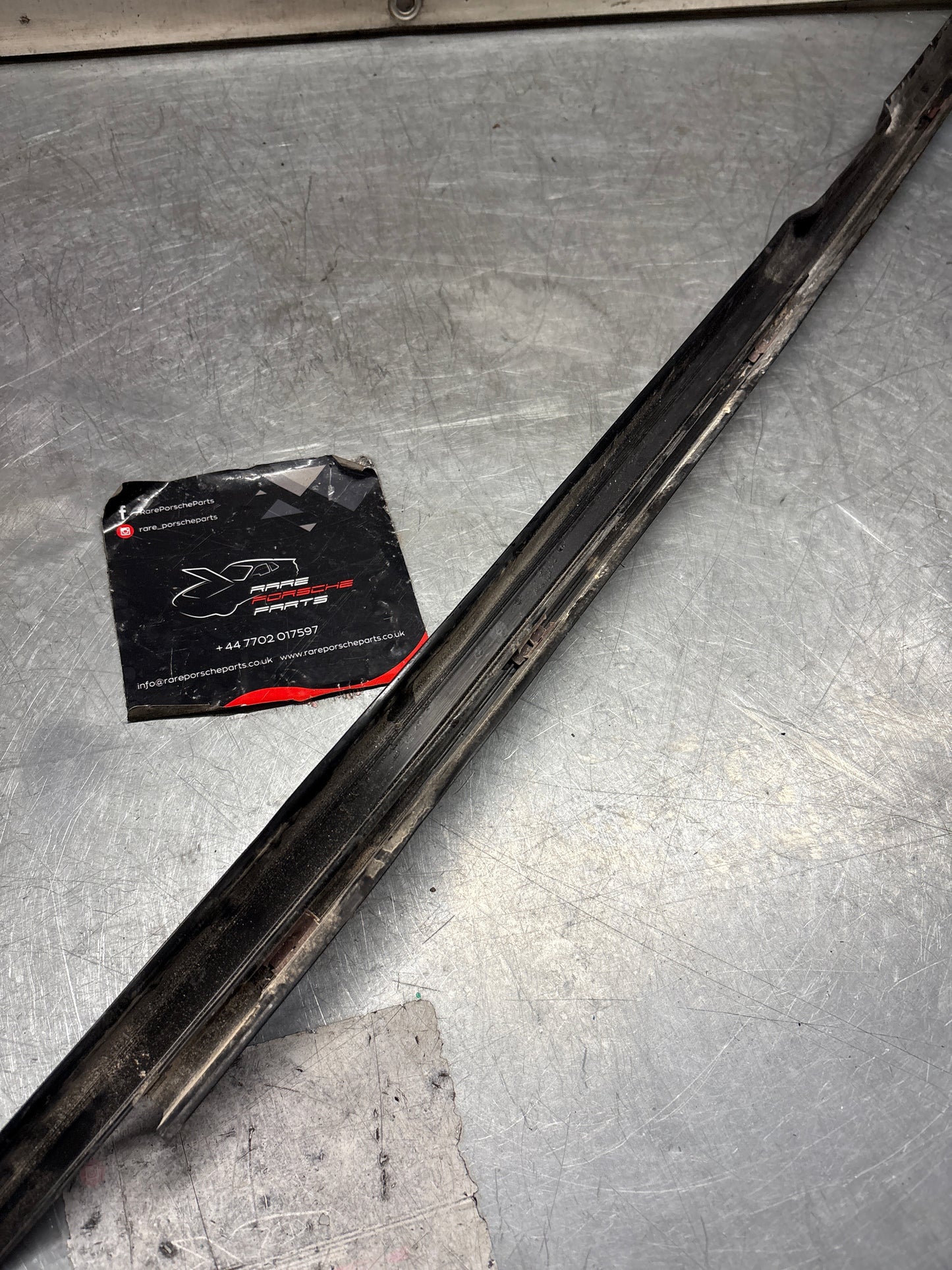 Porsche 944 85.5- left sill trim, scuff plate used 94455112100 cracked