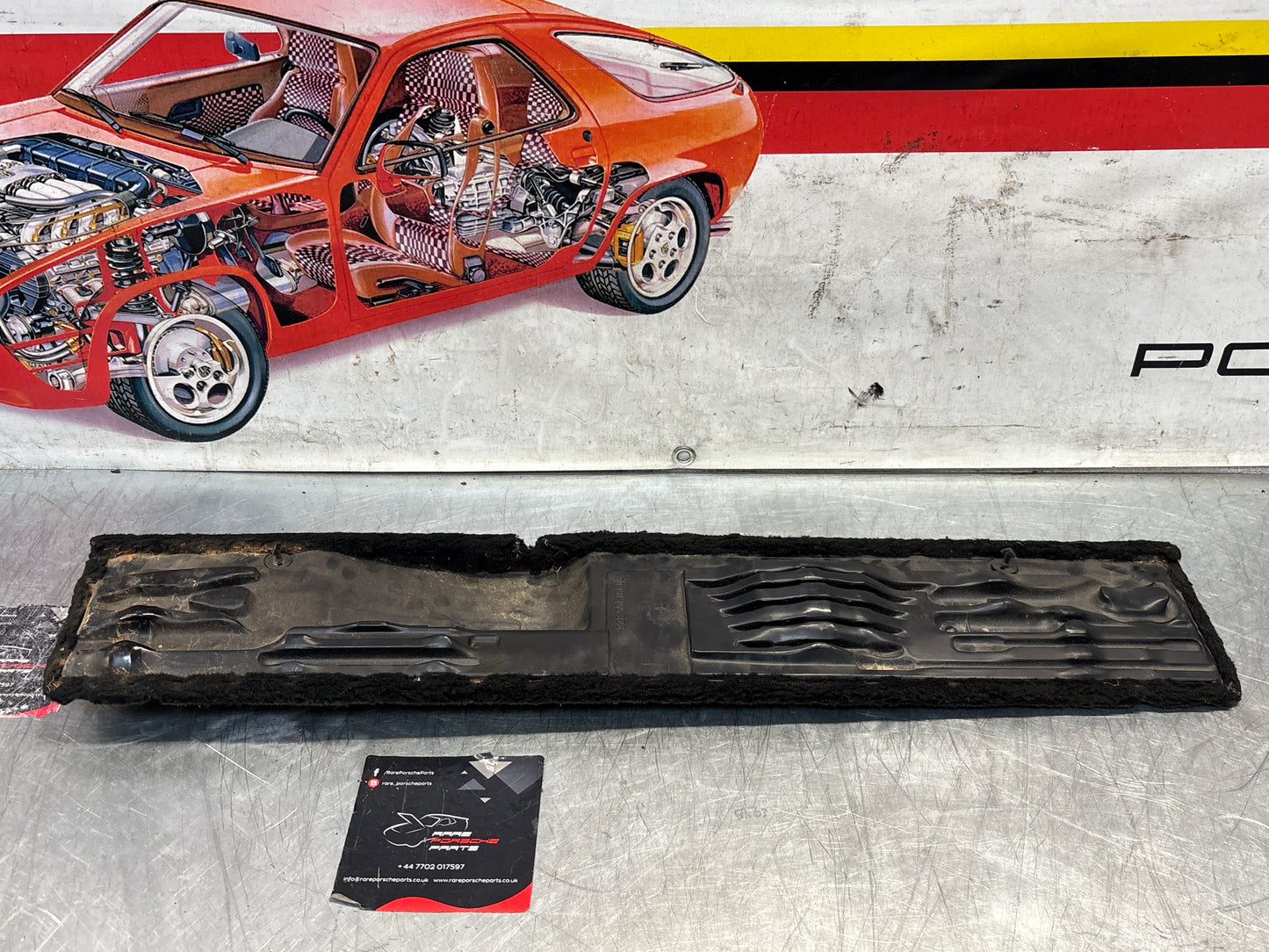 Porsche 928 black/grey-beige carpeted Tool kit panel cover, used 92855118105