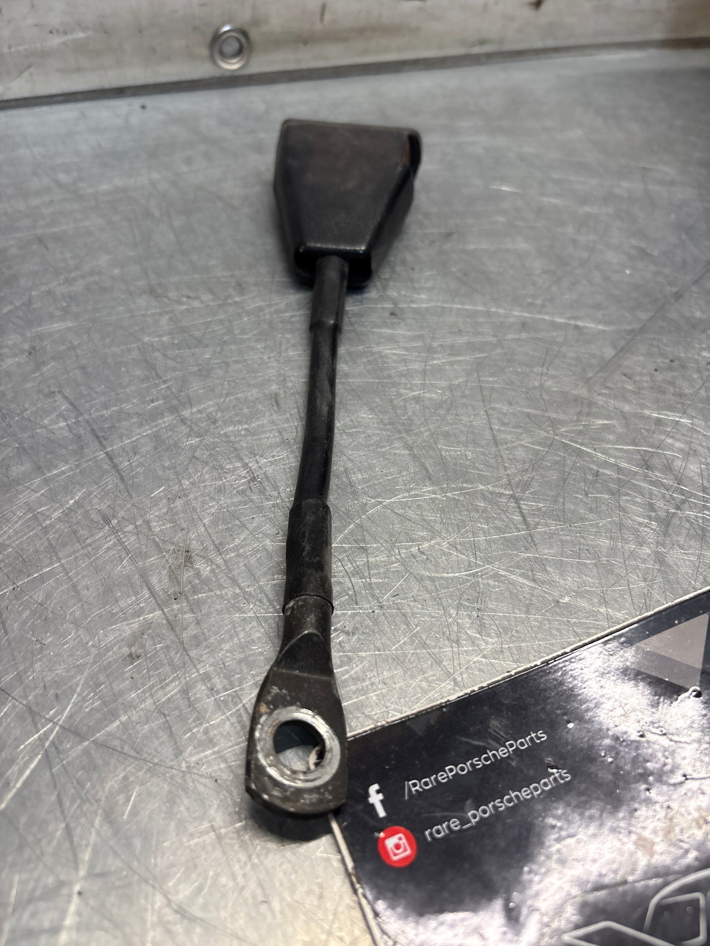 Used Porsche 924 early left seat belt anchor clasp retainer, buckle. 477857755D (used)