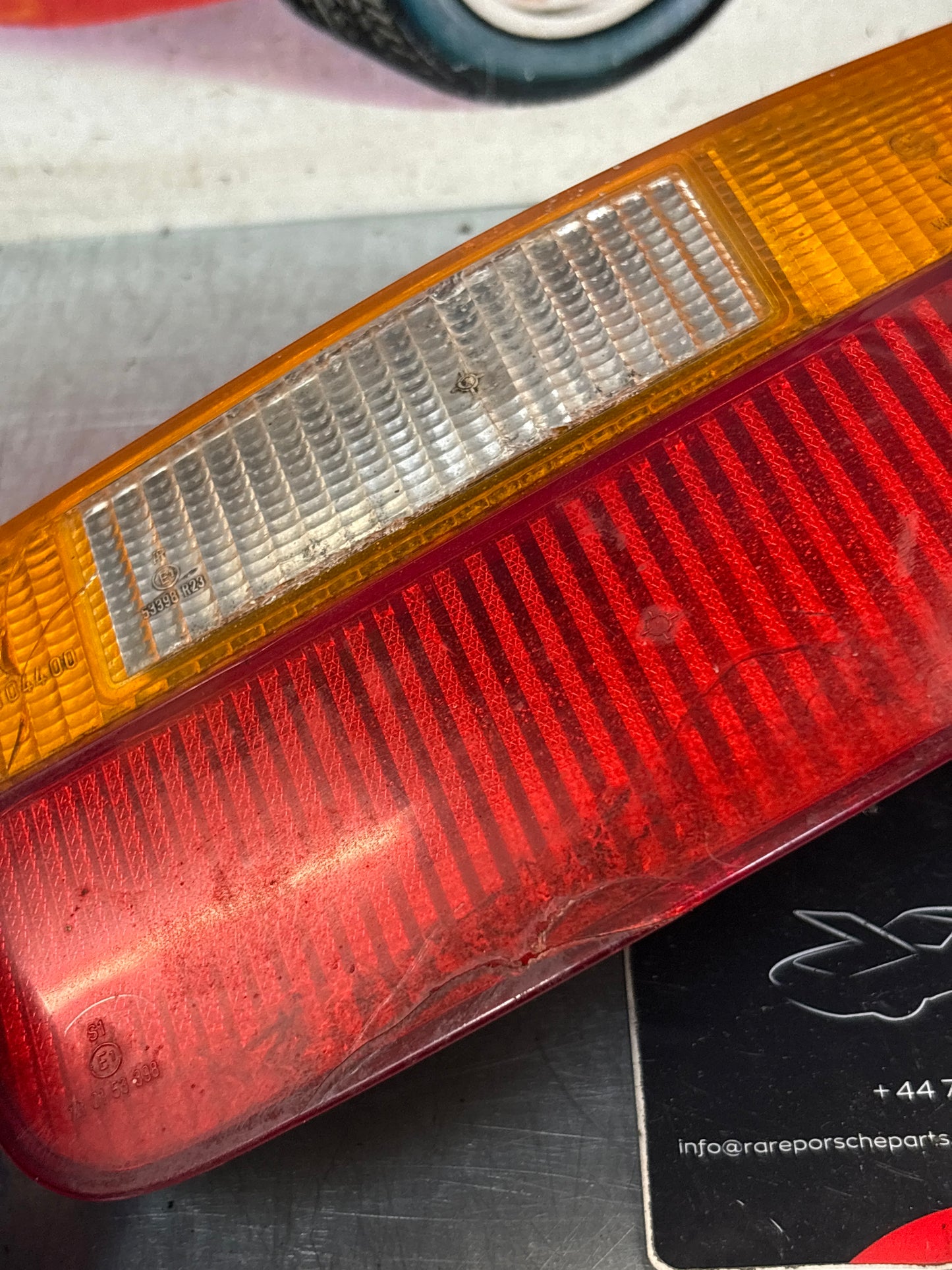 Porsche 928 rear right tail light, used, cracked 92863104400