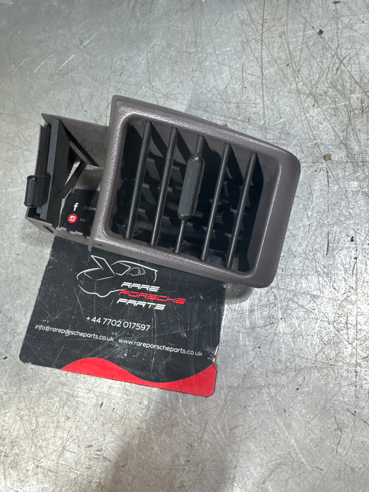 Porsche 944 grey right Interior dash air vent, black vents. 94457225100 used