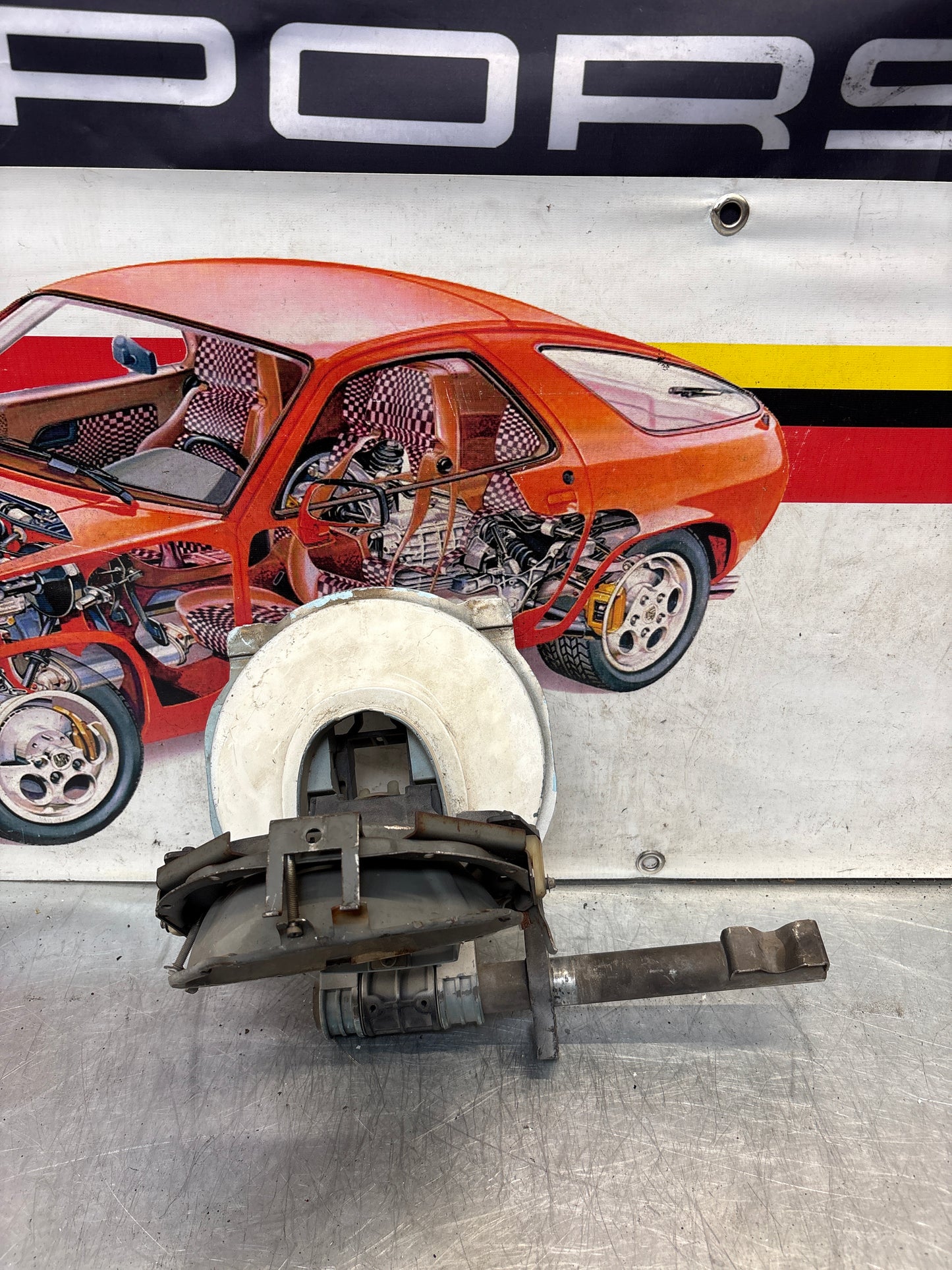 Porsche 928 left headlight swivel frame 92875024902 92875024302 used