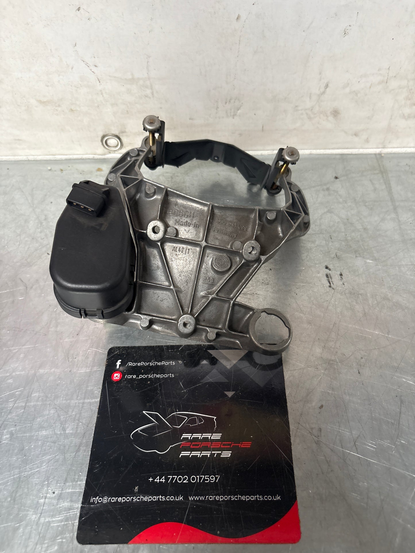 Porsche 968 headlight bracket housing, left 1305541099