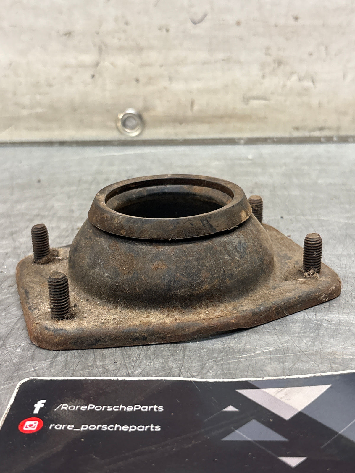 Porsche 924 / 944 front suspension bearing flange, 477412345, used
