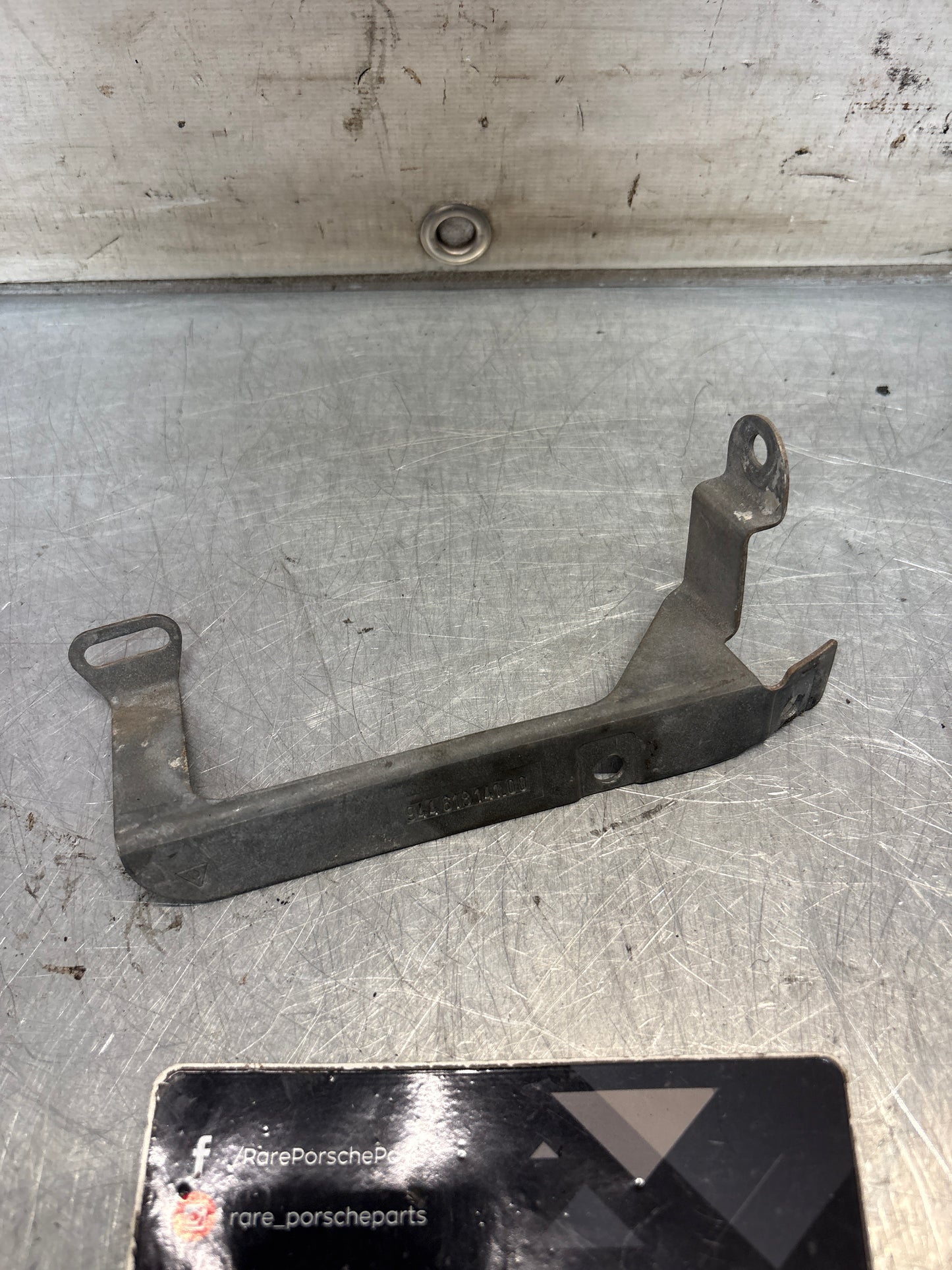 Porsche 944 steering coloumn bracket, left, used 94461814100
