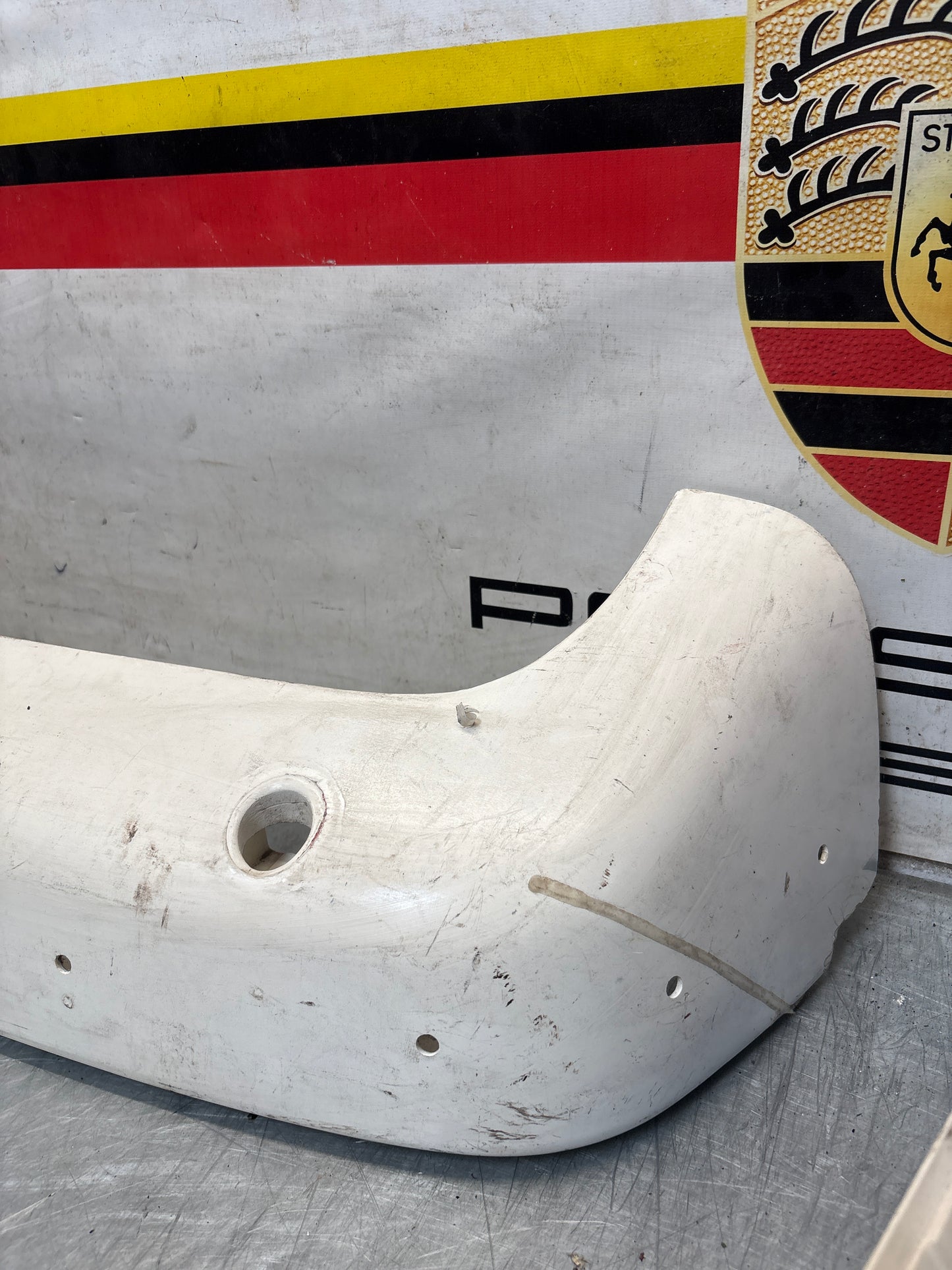 Porsche 944 rear bumper, NOS damaged 93150538700