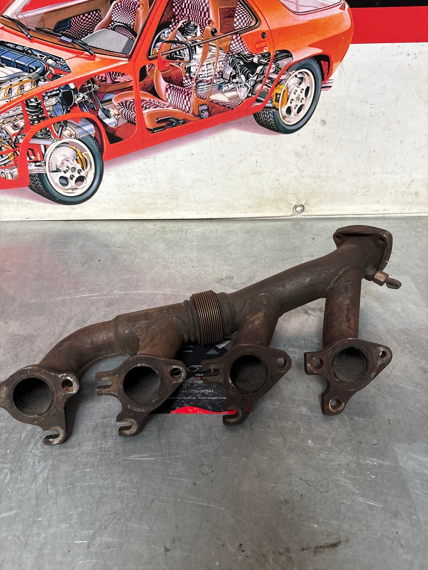 Porsche 928 S4 exhaust manifold, left 92811114507, used