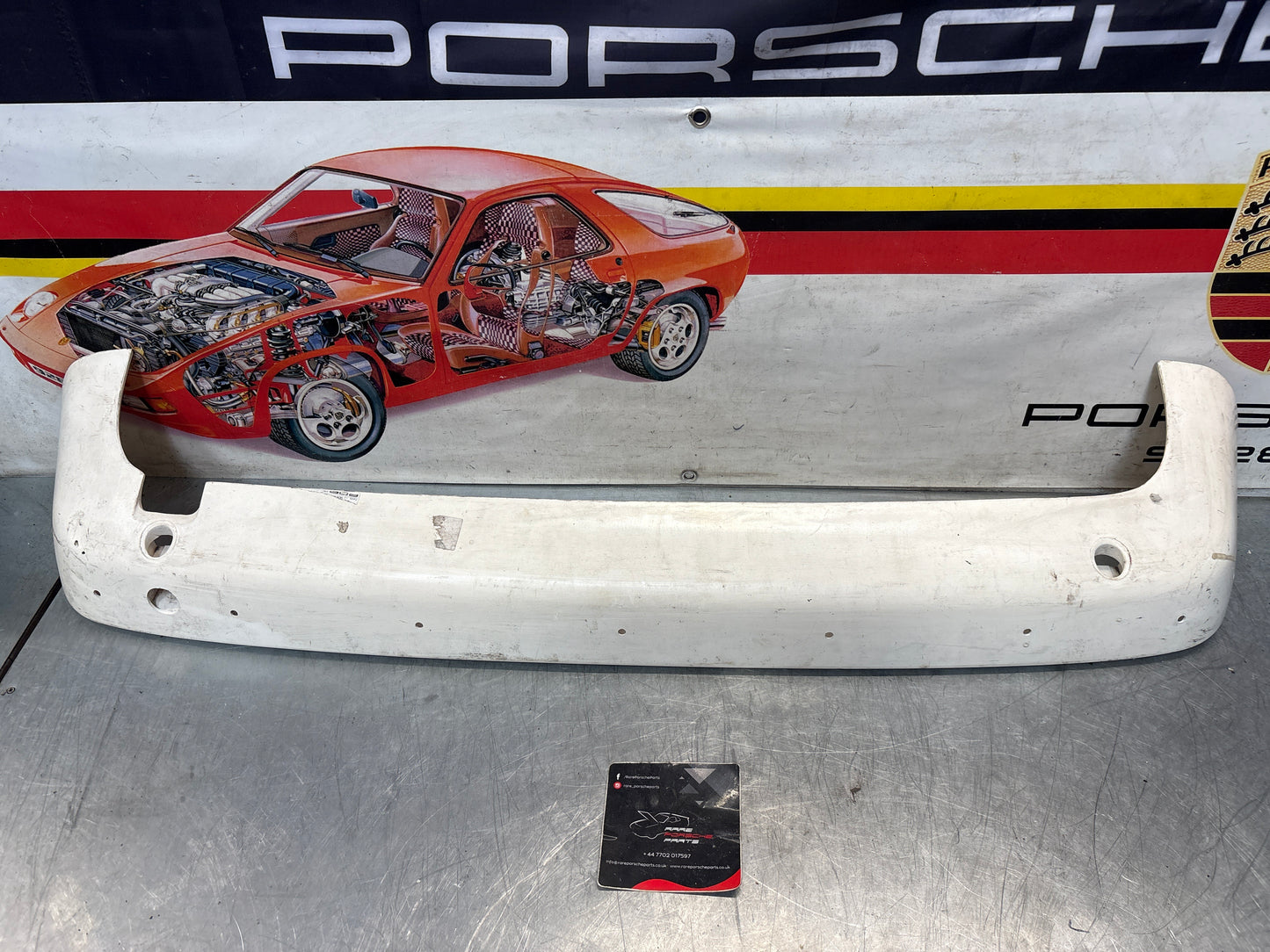 Porsche 944 rear bumper, NOS damaged 93150538700