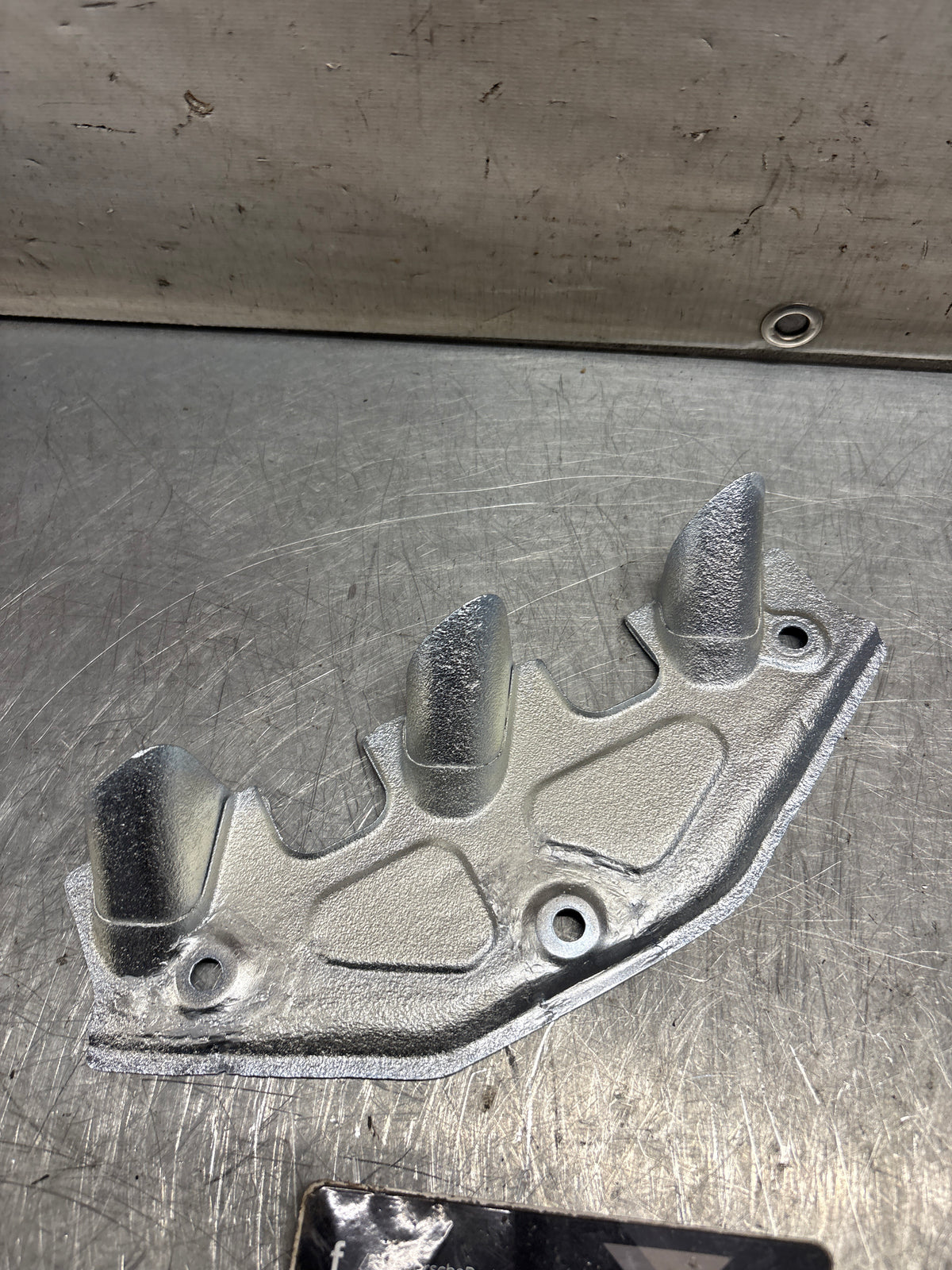 Porsche 924 exhaust heat shield / spark plug shield, refurbished 047129593