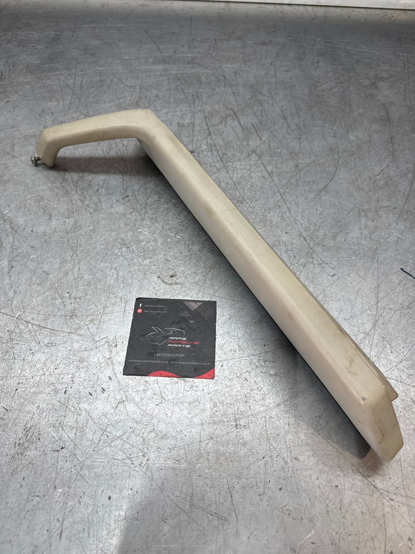 Porsche 944 left door pull handle armrest, white 477867171 used