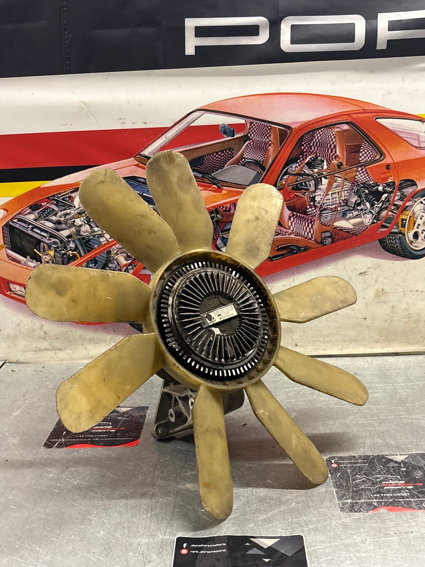 Porsche 928 late engine cooling fan clutch with bracket, used 92810611205 / 92810613701 / 9281061104R