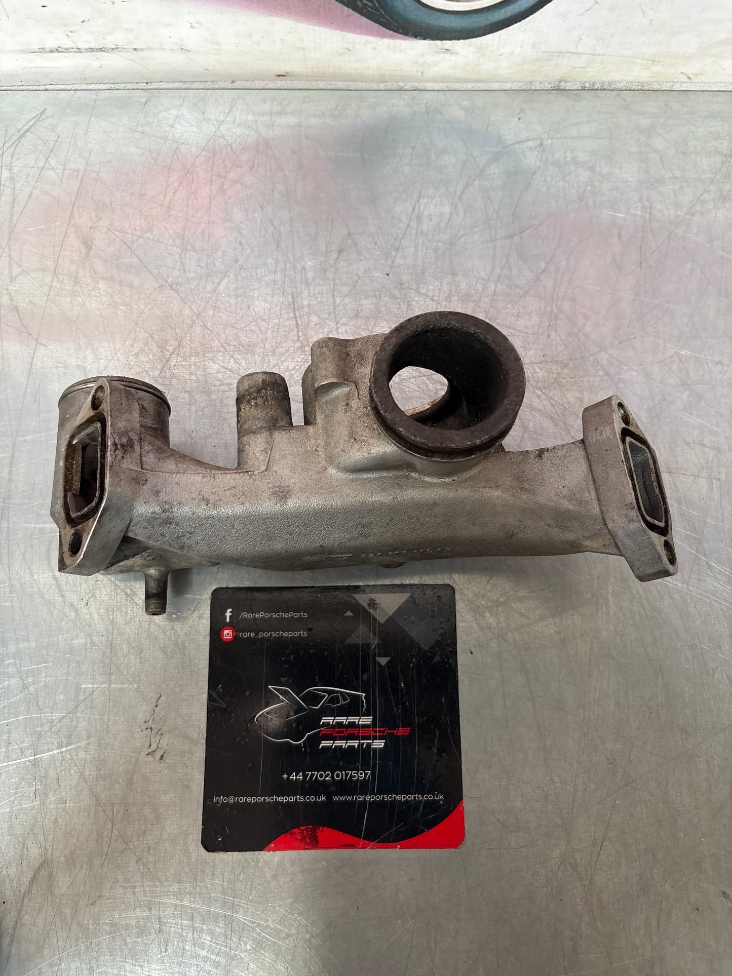 Porsche 928 thermostat housing, used 9281061616R