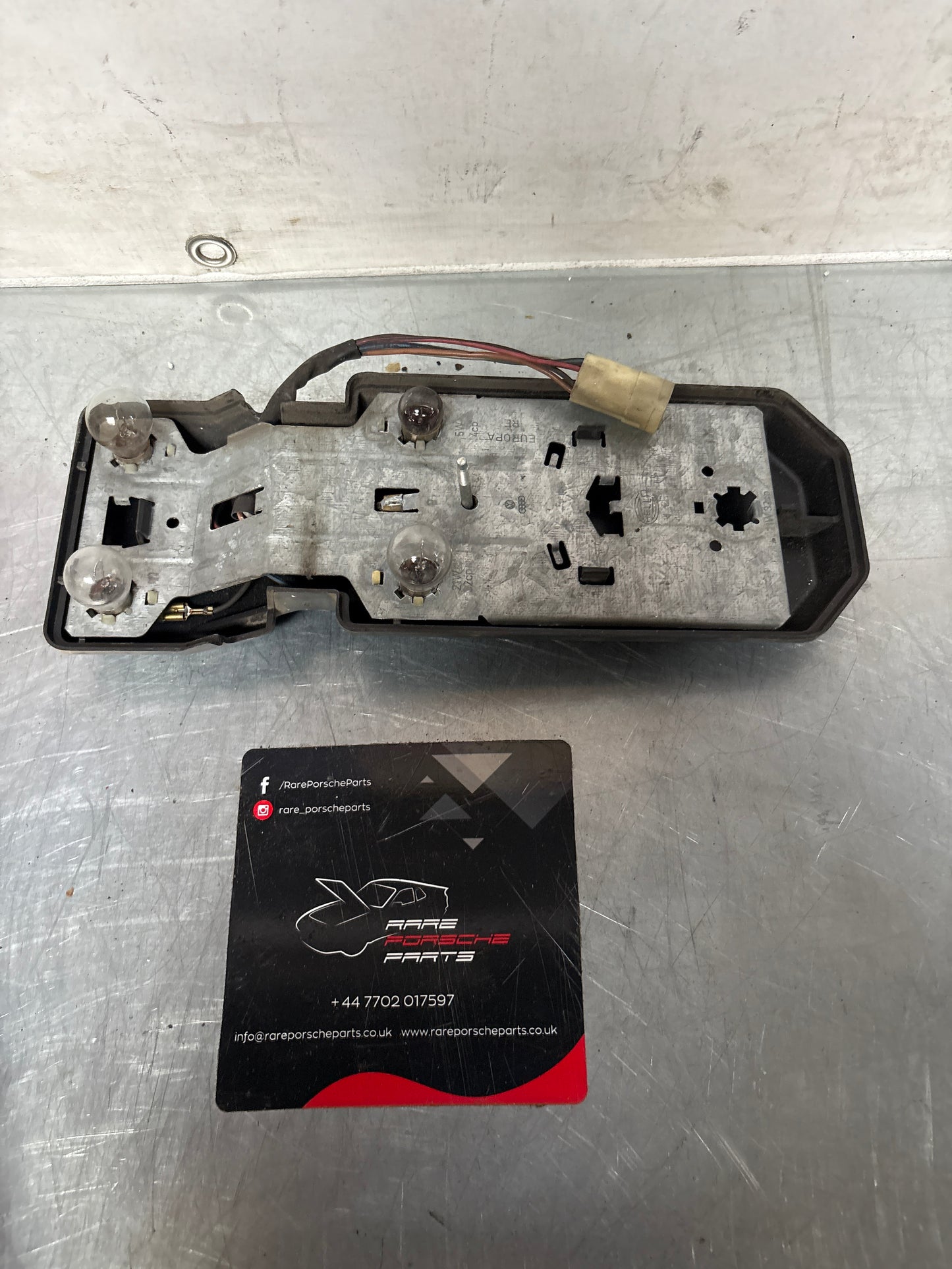 Porsche 944 rear left Tail light lamp bulb holder and cover, used 477945113