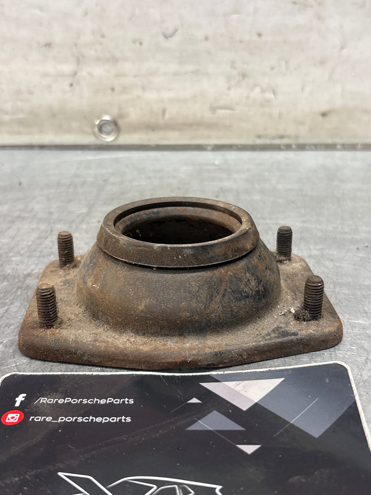 Porsche 924 / 944 front suspension bearing flange, 477412345, used