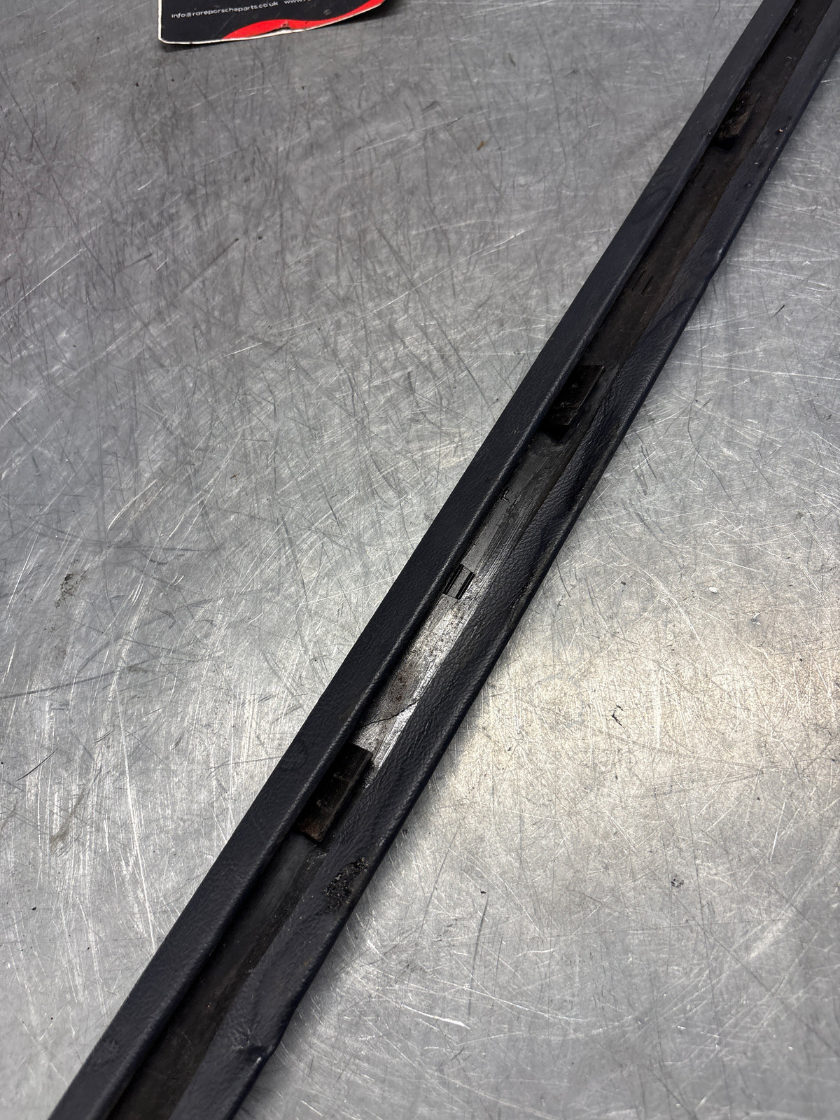 Porsche 928 tailgate trim, left, near side, marine blue, 92855503702, used