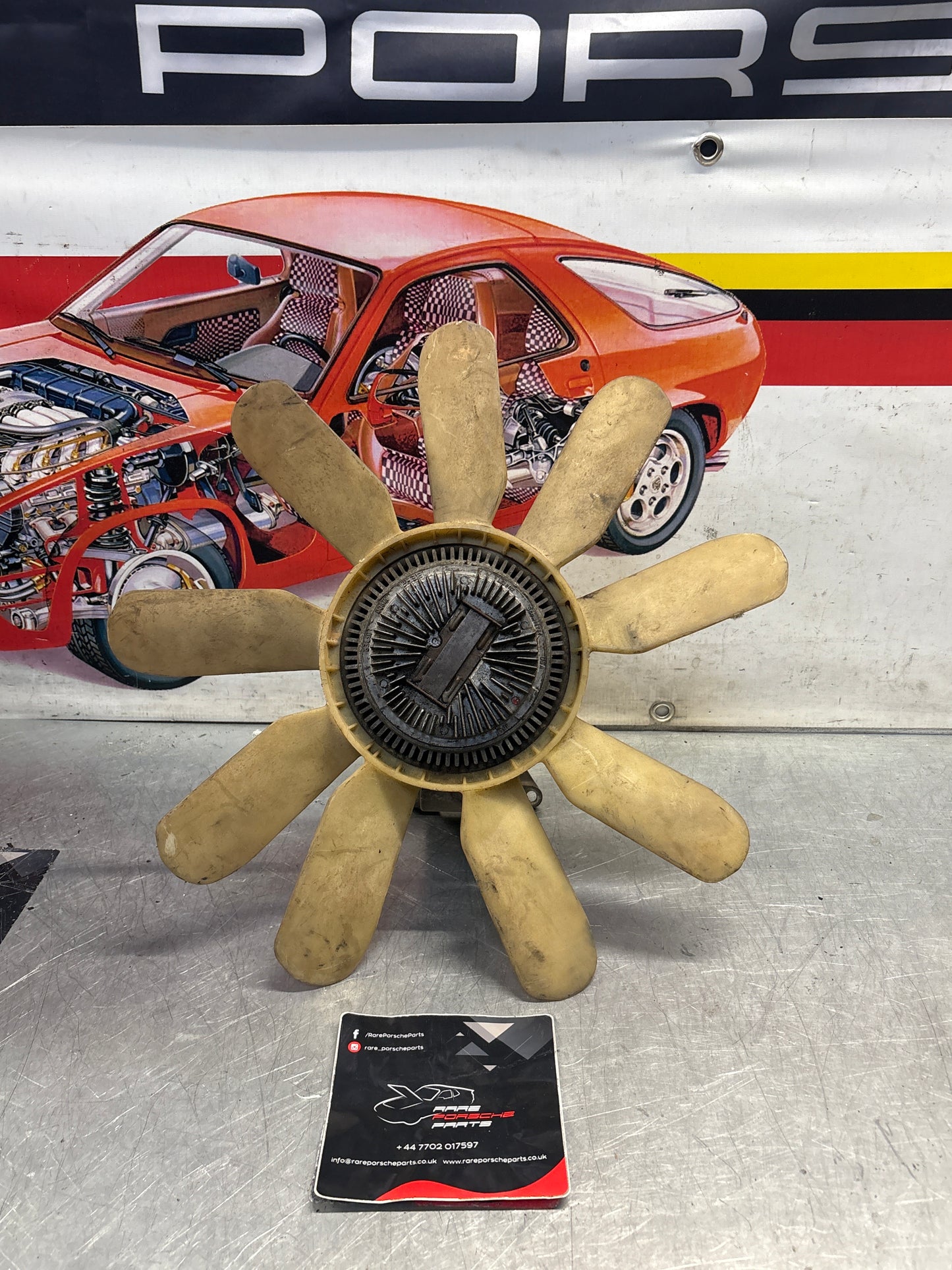 Porsche 928 late engine cooling fan clutch with bracket, used 92810611205 / 92810613701 / 9281061104R