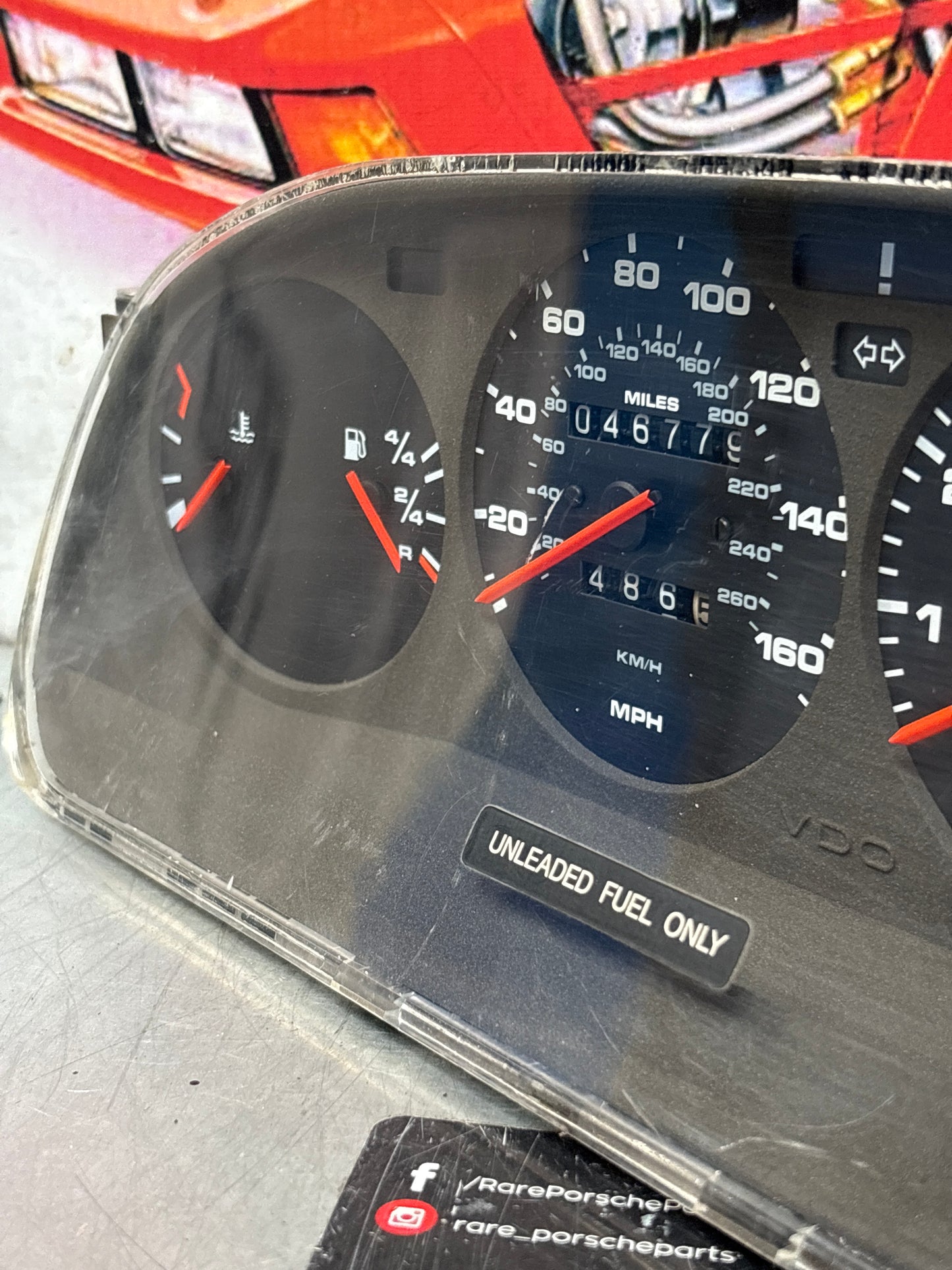 Porsche 928 dash clock binnacle pod speedometer, 92864110235 used  showing 046779 Km, plastic screen has some scratches