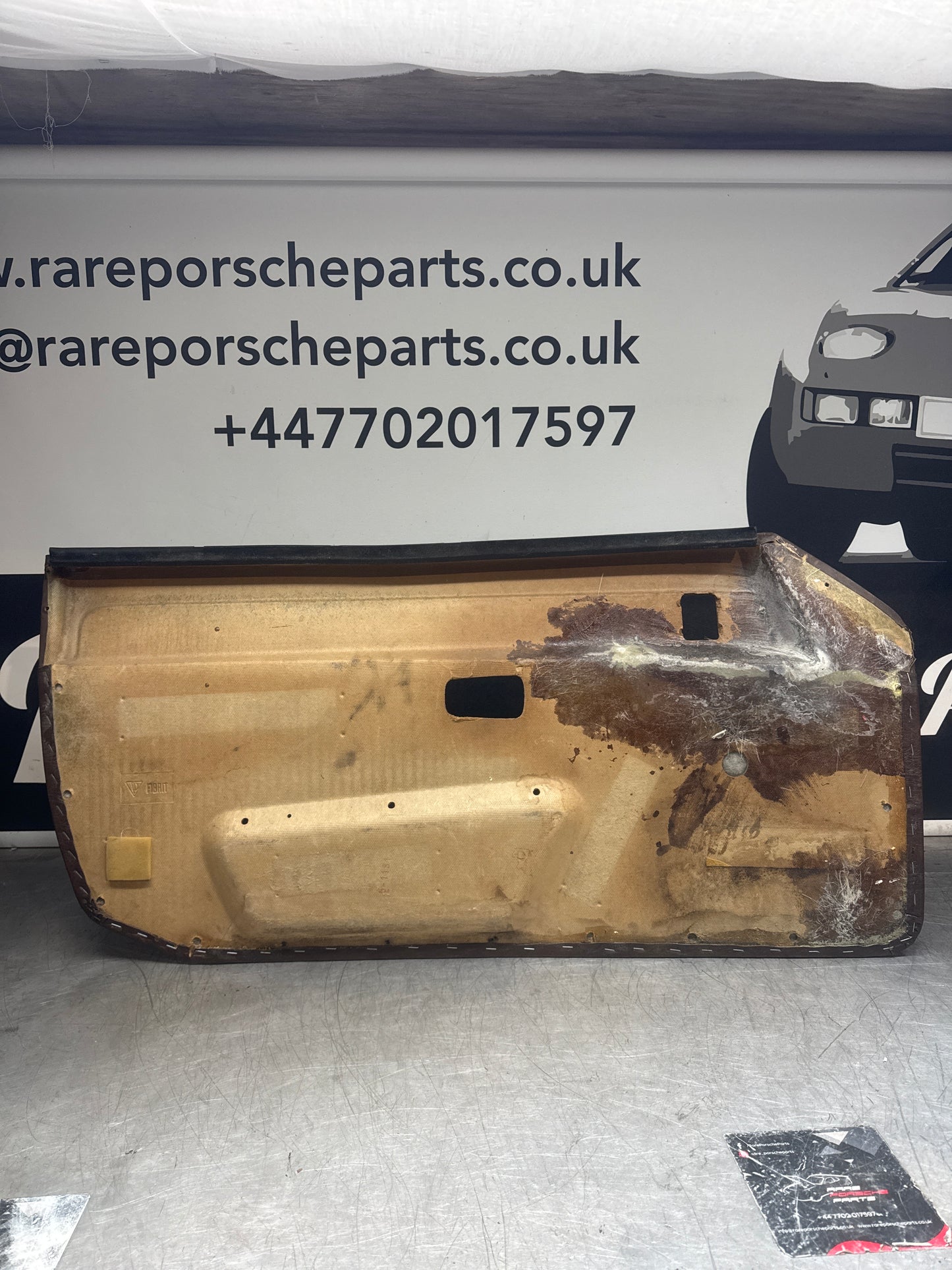 Porsche 924 / Early 944 Brown Script Door card. Left Hand Drive. Used. 478867011. Fibreglass repaired.