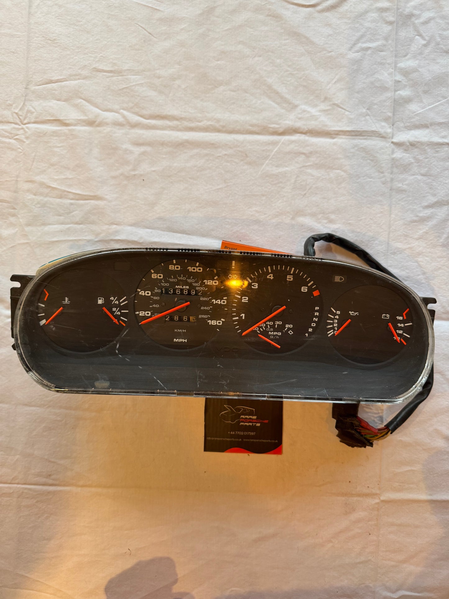 Porsche 944 dash clock binnacle pod speedometer, automatic 94564131101 used 136892 miles, scratched screen