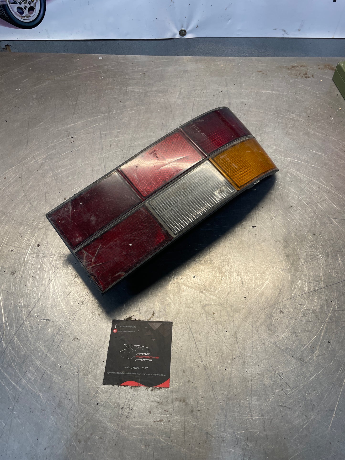 Porsche 924 / 944 left tail light, used, cracked