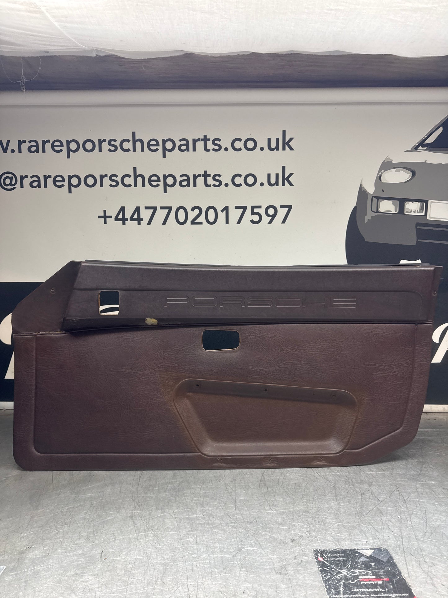 Porsche 924 / Early 944 Brown Script Door card. Left Hand Drive. Used. 478867011. Fibreglass repaired.