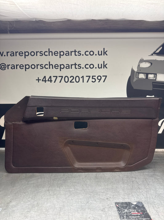 Porsche 924 / Early 944 Brown Script Door card. Left Hand Drive. Used. 478867011. Fibreglass repaired.