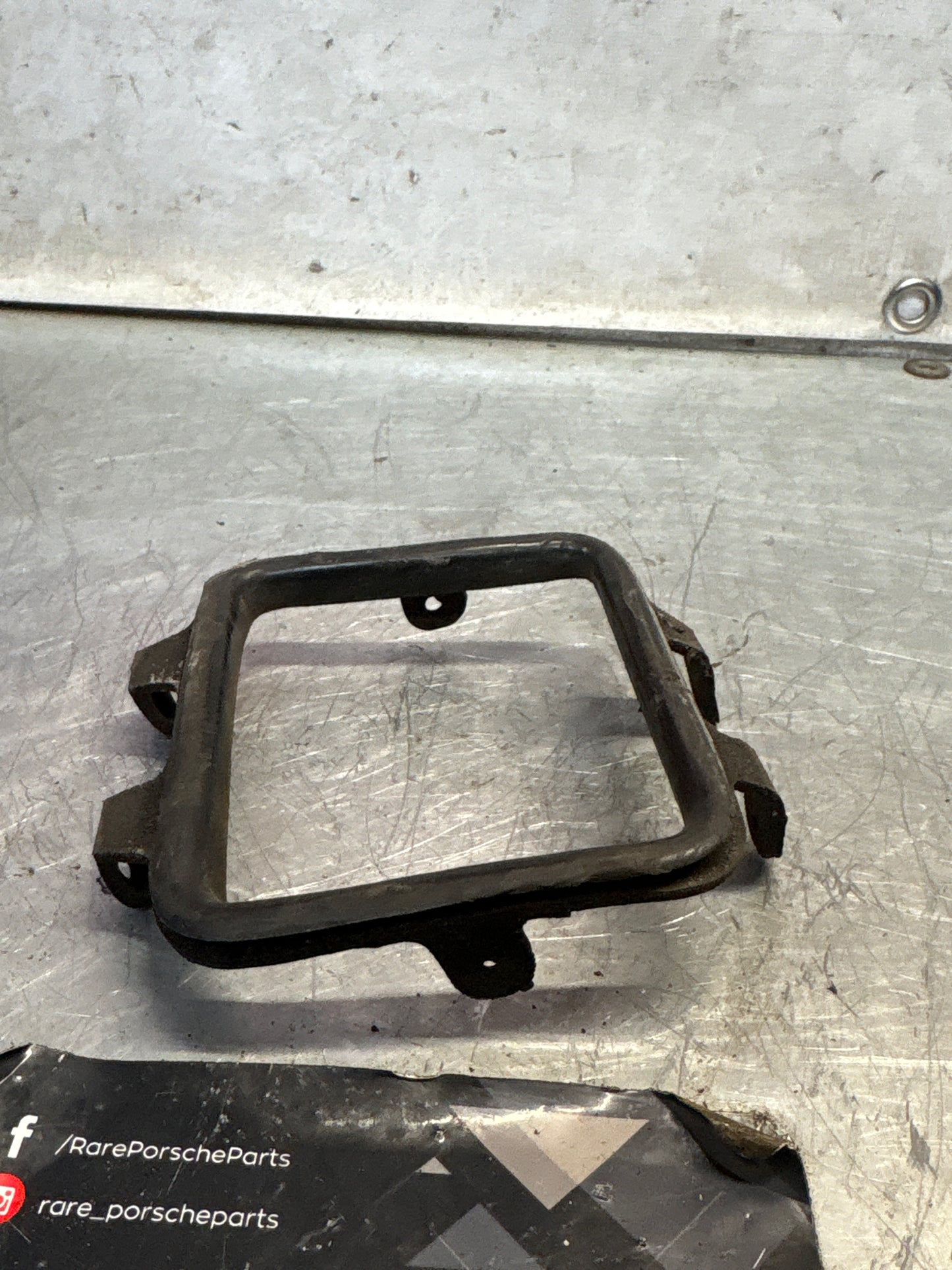 Porsche 928 rear fog light frame, left, used 92850528502
