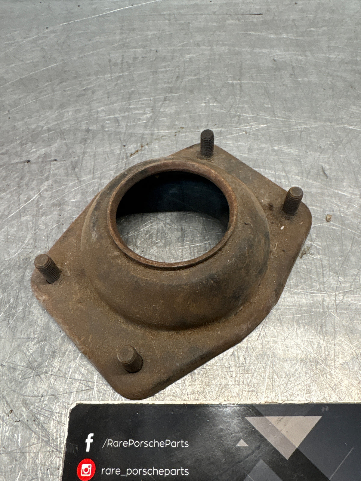 Porsche 924 / 944 front suspension bearing flange, 477412345, used