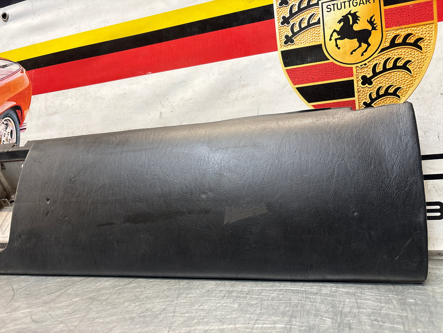 Porsche 911 964 dashboard lower knee protection trim, black leather, used 96455207304 / 96455207300
