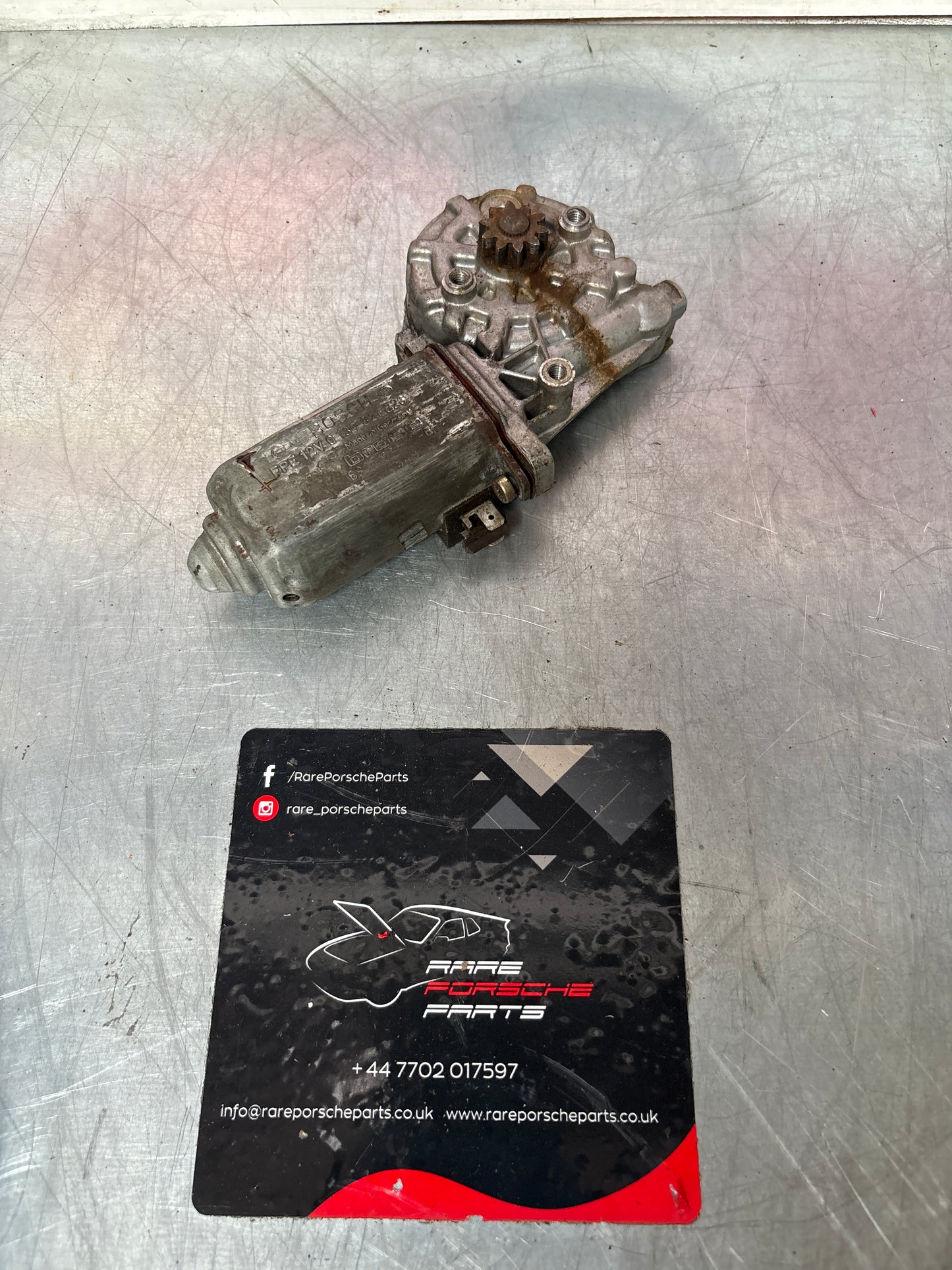 Porsche 911 left window motor, used 0130821026