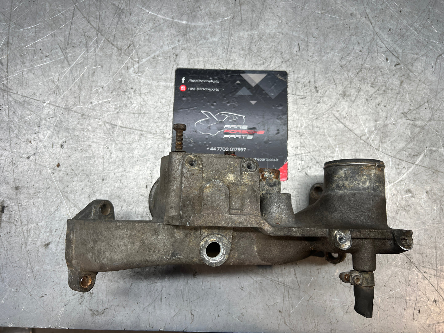 Porsche 928 thermostat housing, used 9281061614R