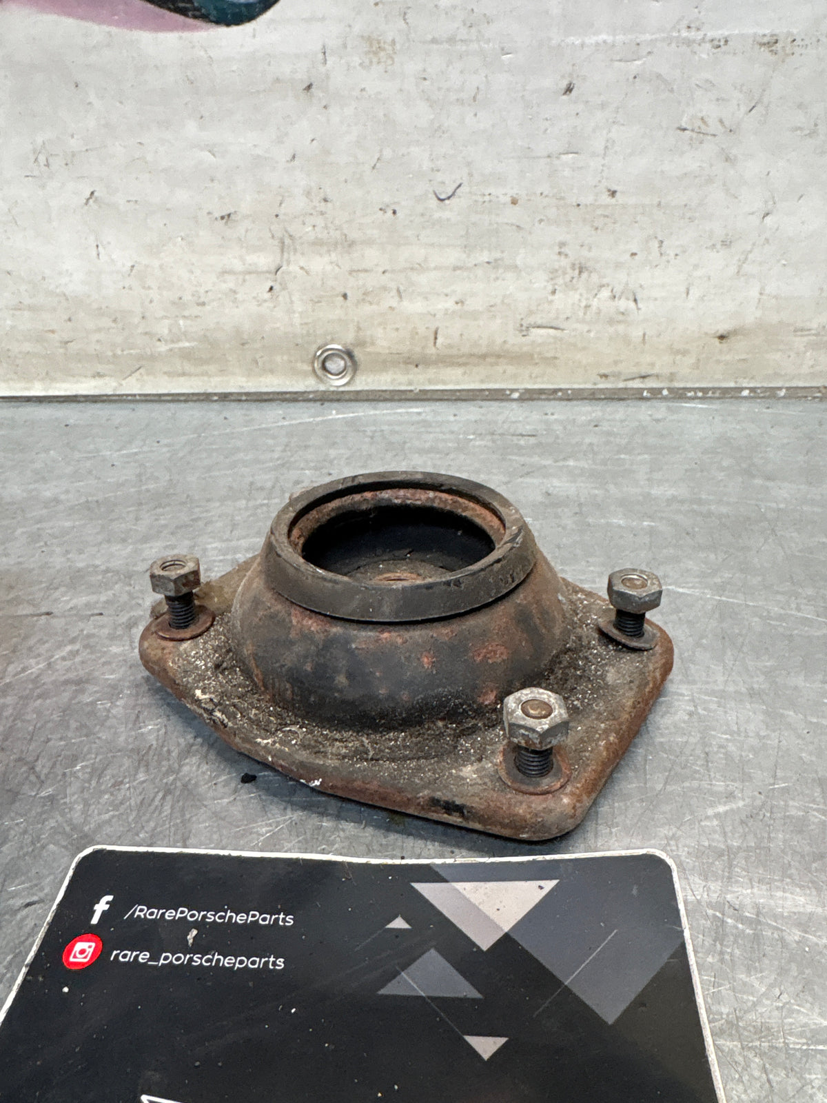 Porsche 924 / 944 front suspension bearing flange, 477412345, used