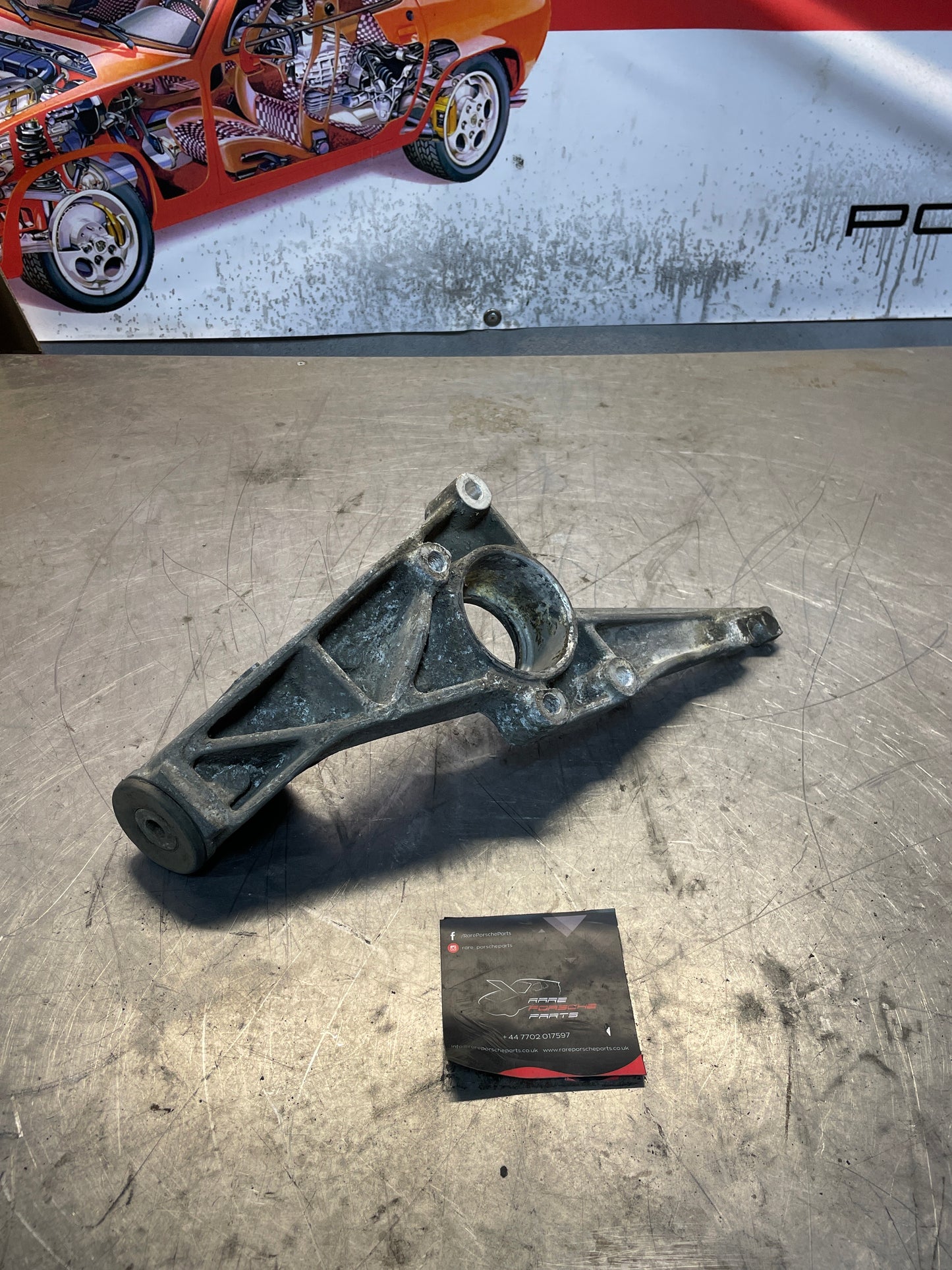 Porsche 924 / 944 left rear torsion bar mount, used 477501659B