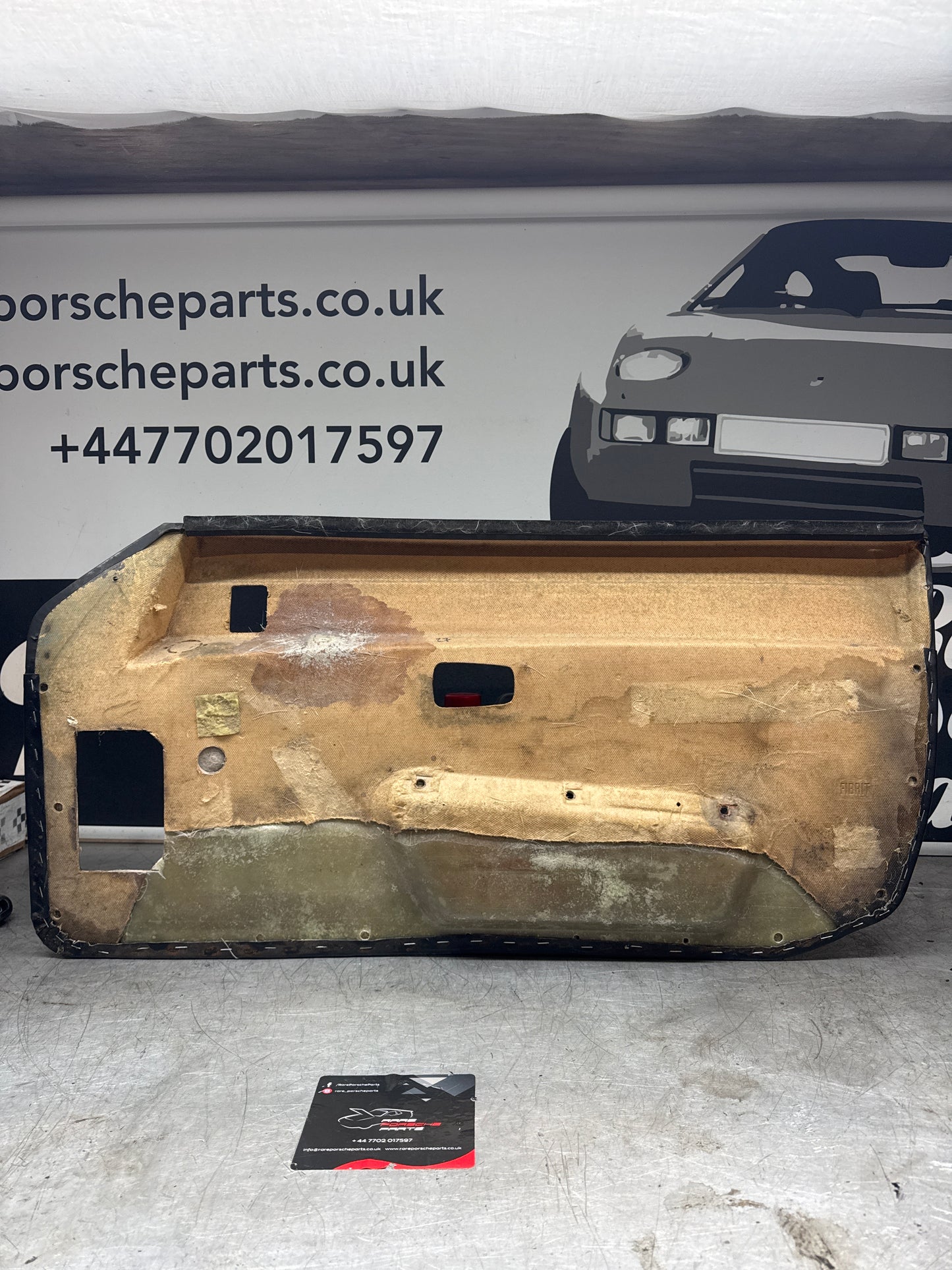 Porsche 924/ Early 944 black RHD Left door card. Fibreglass repaired. 477867012