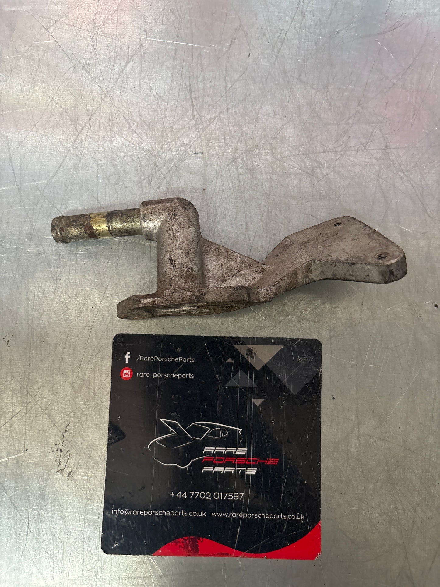 Porsche 928 water outlet housing, used 9281044310R