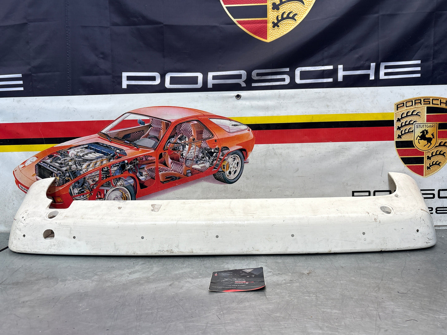 Porsche 944 rear bumper, NOS damaged 93150538700