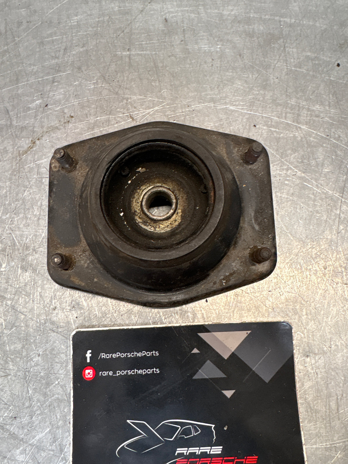 Porsche 924 / 944 front suspension bearing flange, 477412345, used