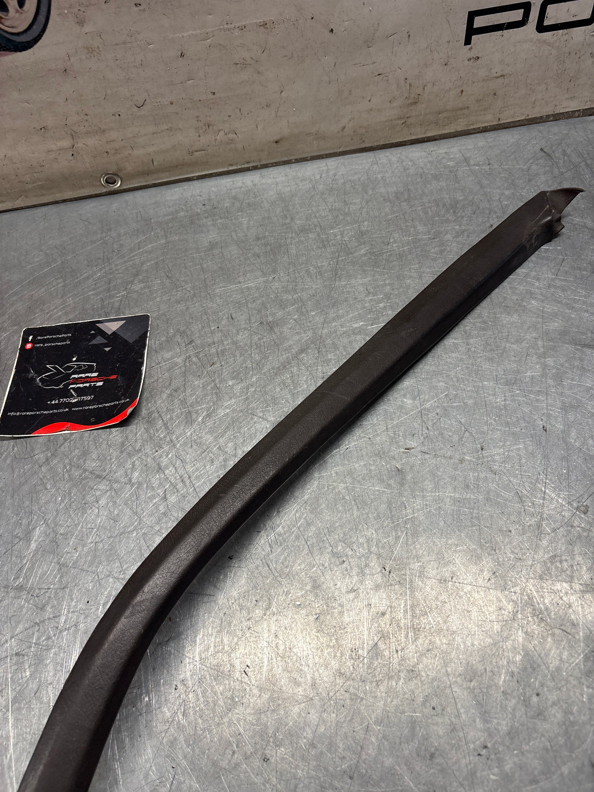 Porsche 928 left, off side door upper frame surround trim, brown 92855502502, used