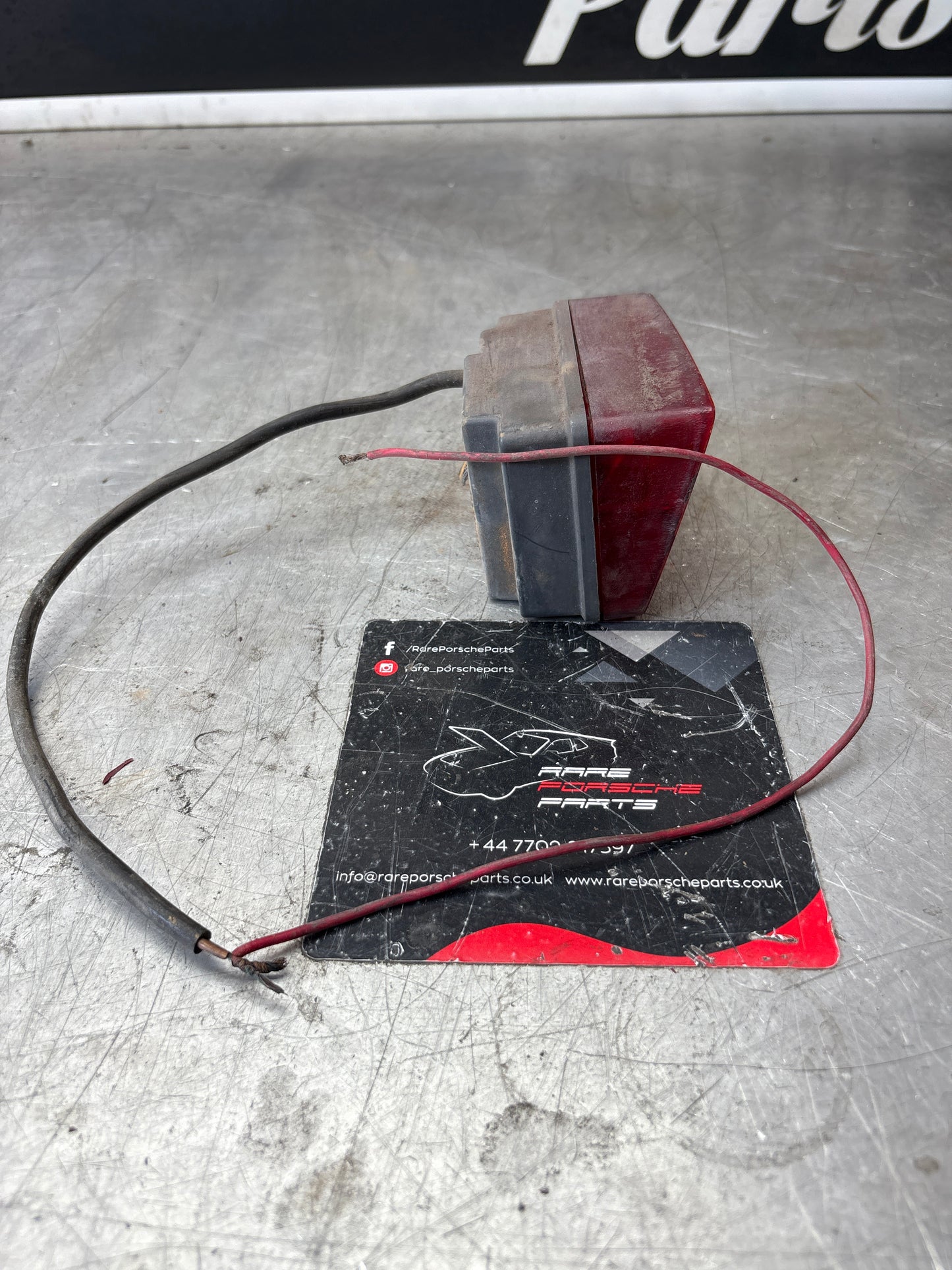 Porsche 928 left rear fogliht, used 92863142801R / 92863142701L spares or repair