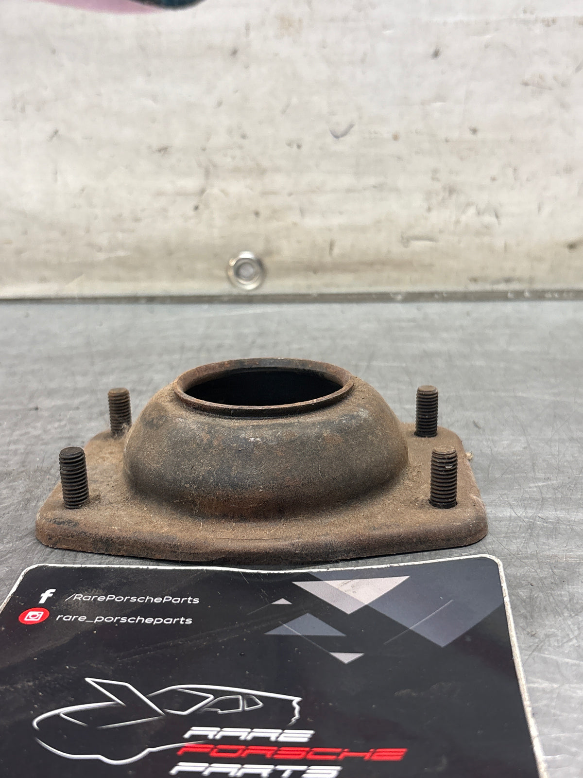 Porsche 924 / 944 front suspension bearing flange, 477412345, used
