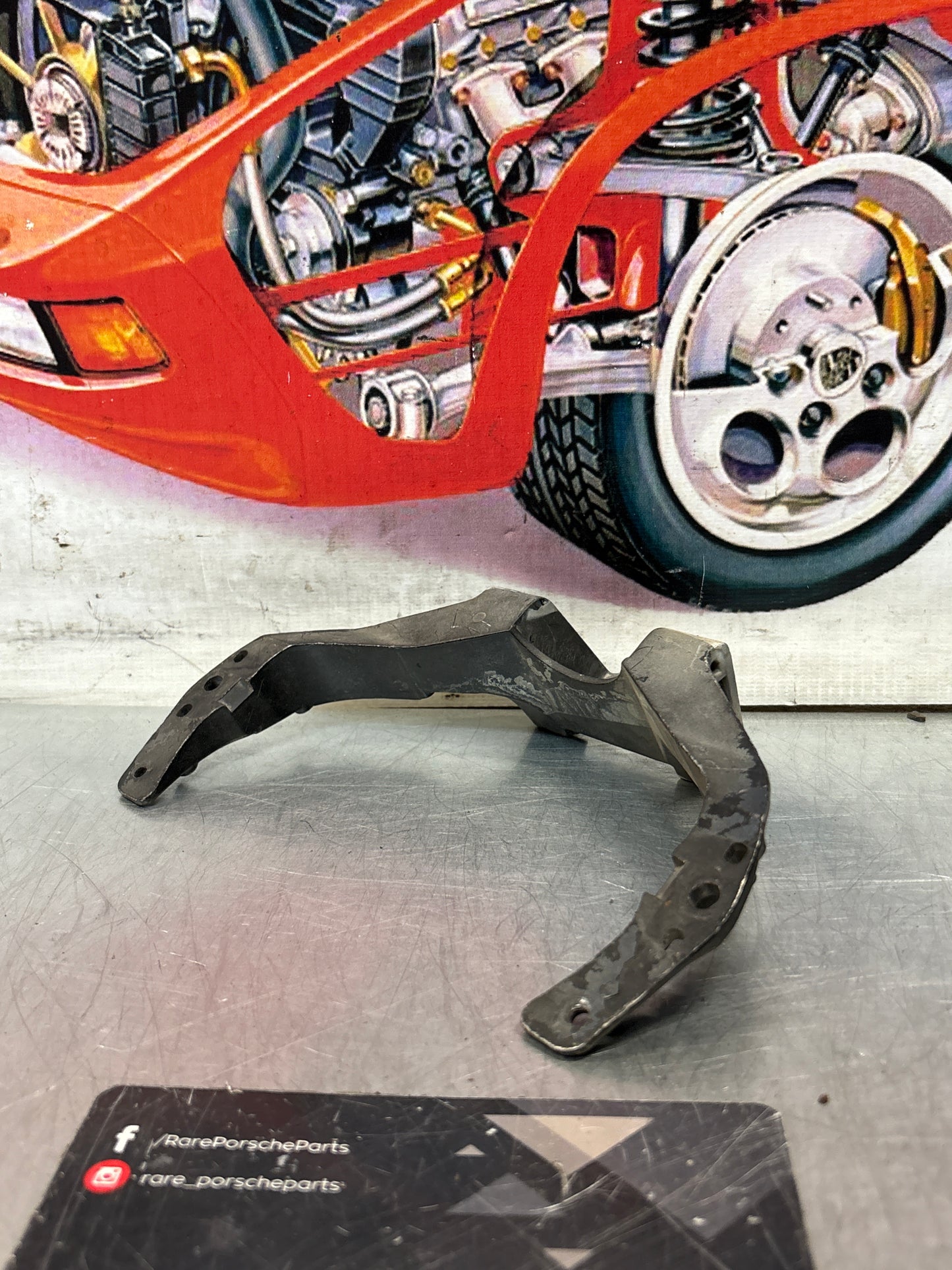 Porsche 928 headlight support arm, used 92875028502