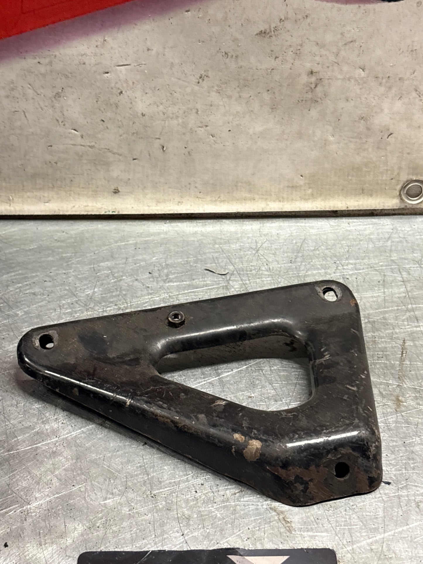 Porsche 924 exhaust manifold support bracket, used 93111014501