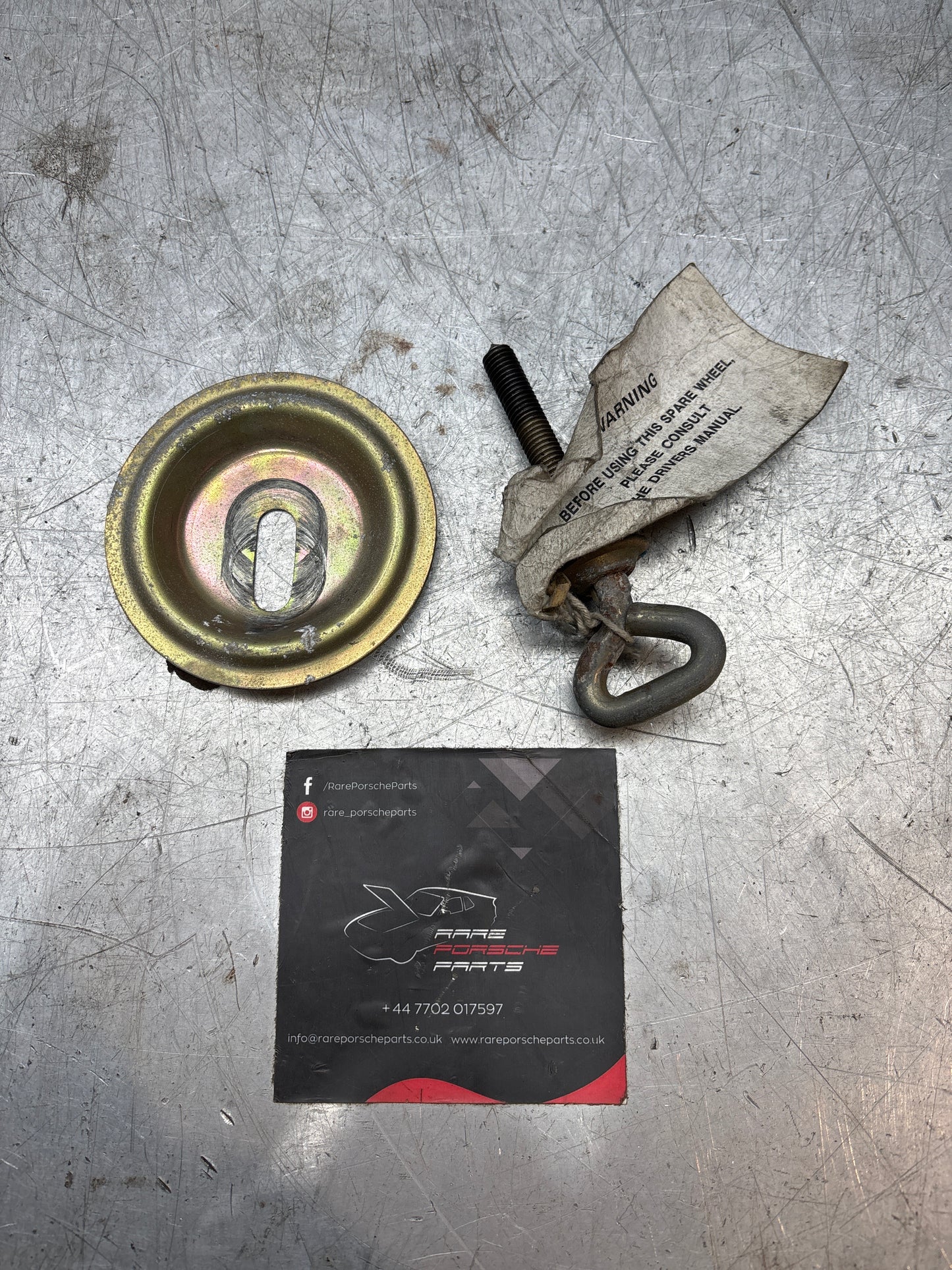 Porsche 924/944 spare wheel retaining plate & long bolt, with genuine label on it