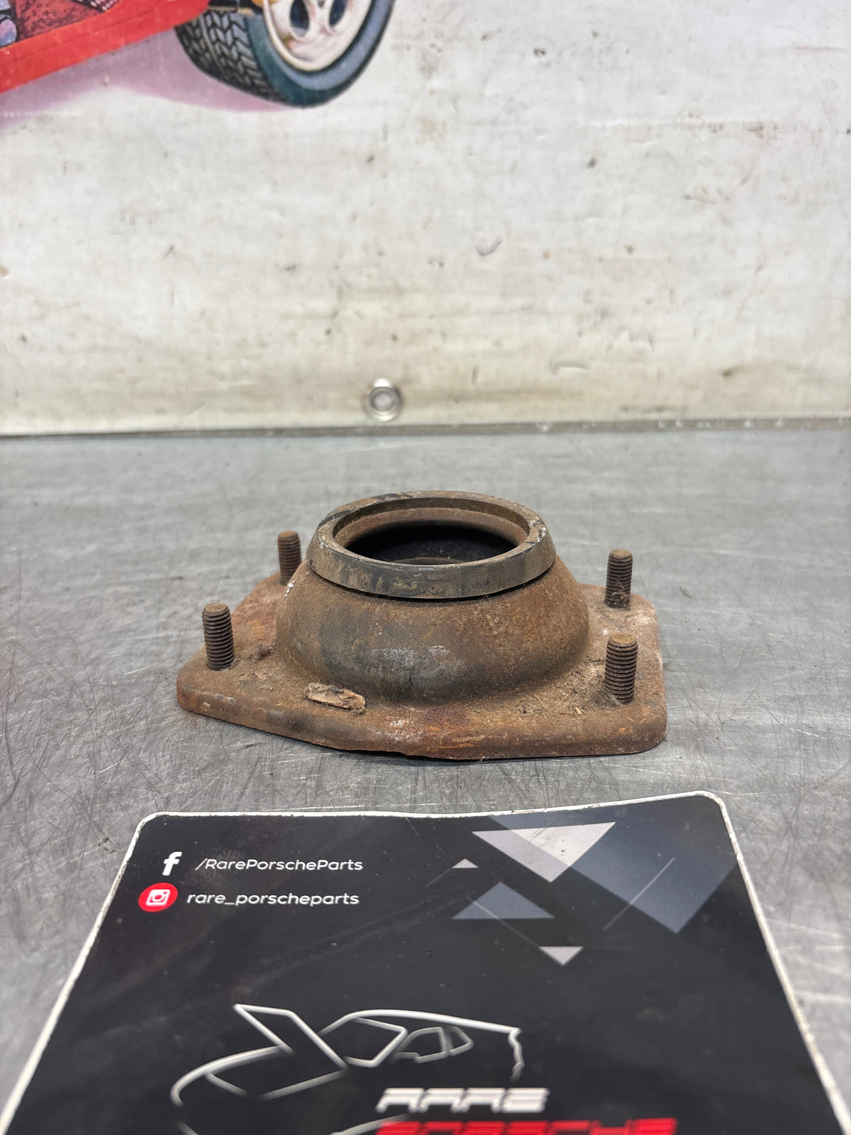 Porsche 924 / 944 front suspension bearing flange, 477412345, used